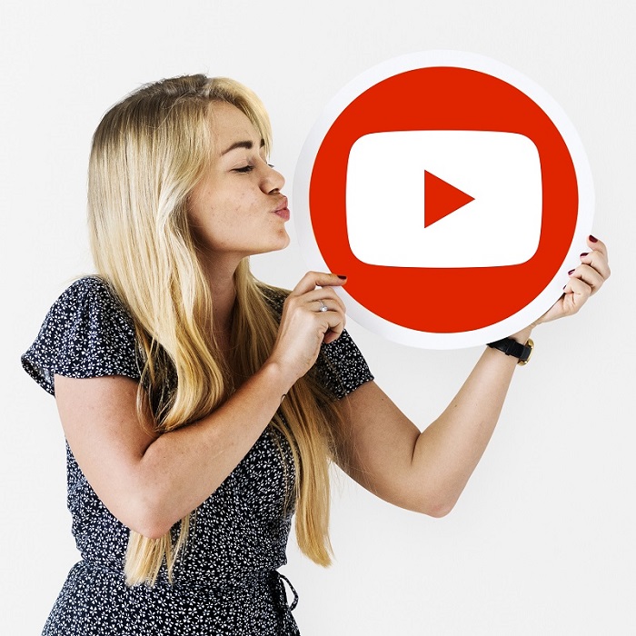 Woman holding a YouTube icon
